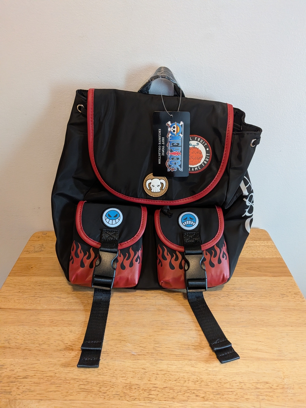 Onepiece Black Backpack with Red Flame Accents